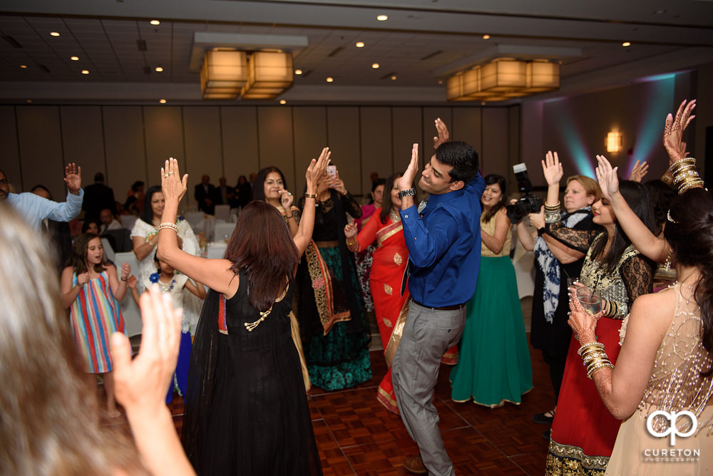 Wedding guests dancing at the reception.