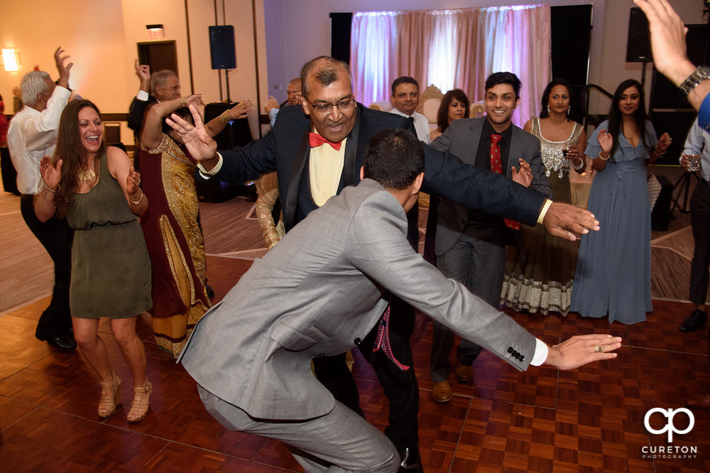 Wedding guests dancing at the reception.