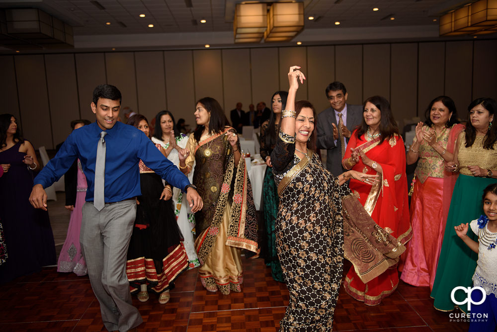 Wedding guests dancing at the reception.