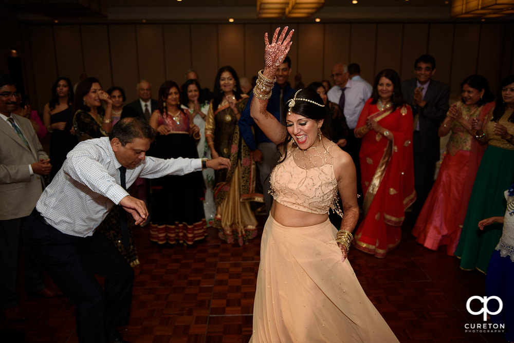 Wedding guests dancing at the reception.