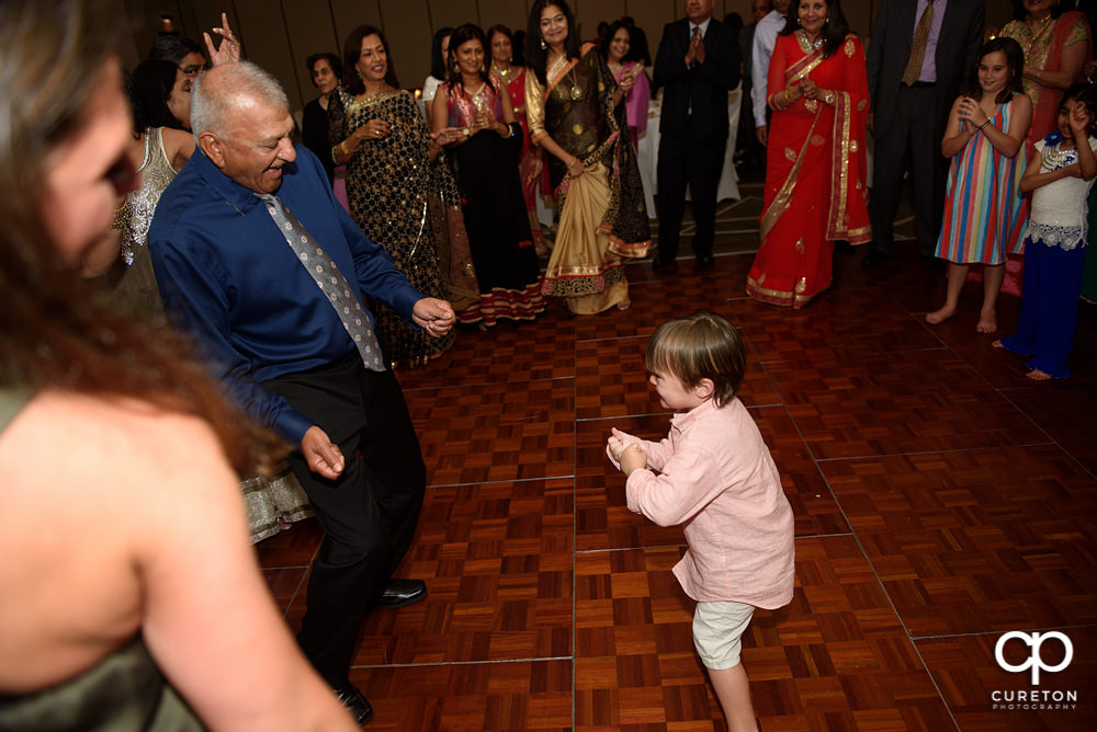 Wedding guests dancing at the reception.