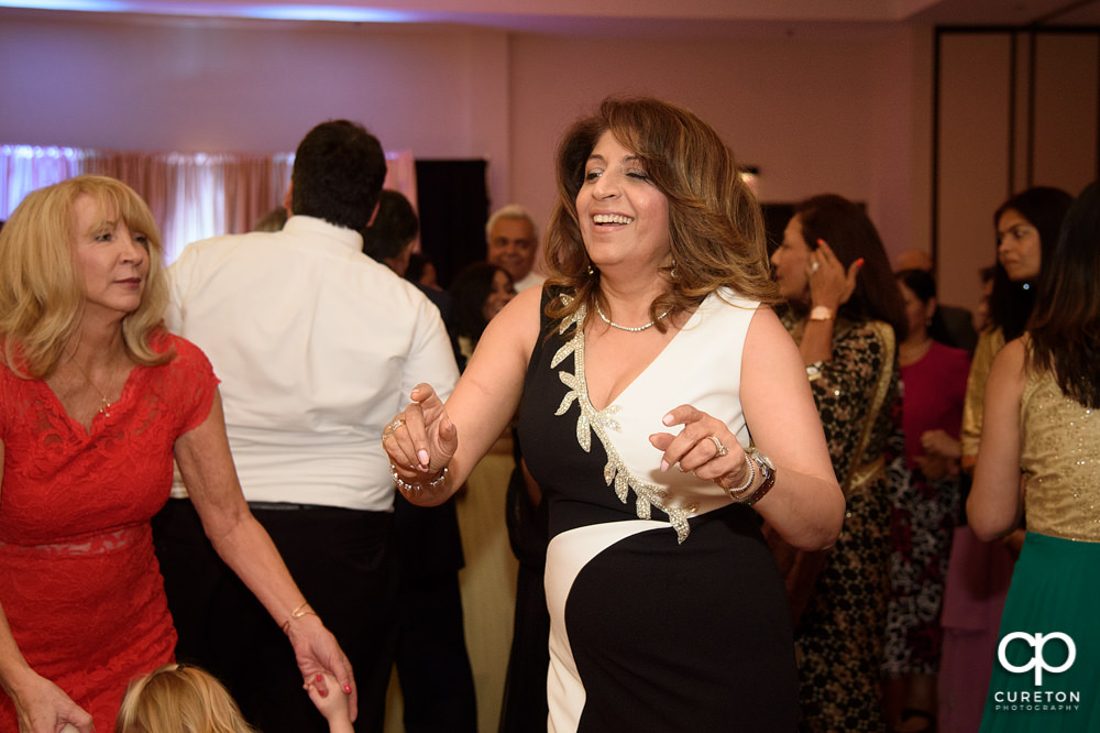 Wedding guests dancing at the reception.