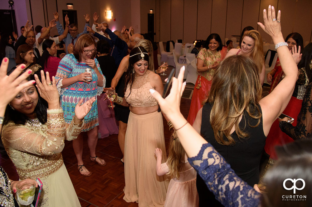 Wedding guests dancing at the reception.