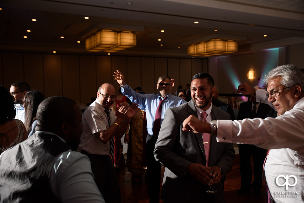 Wedding guests dancing at the reception.