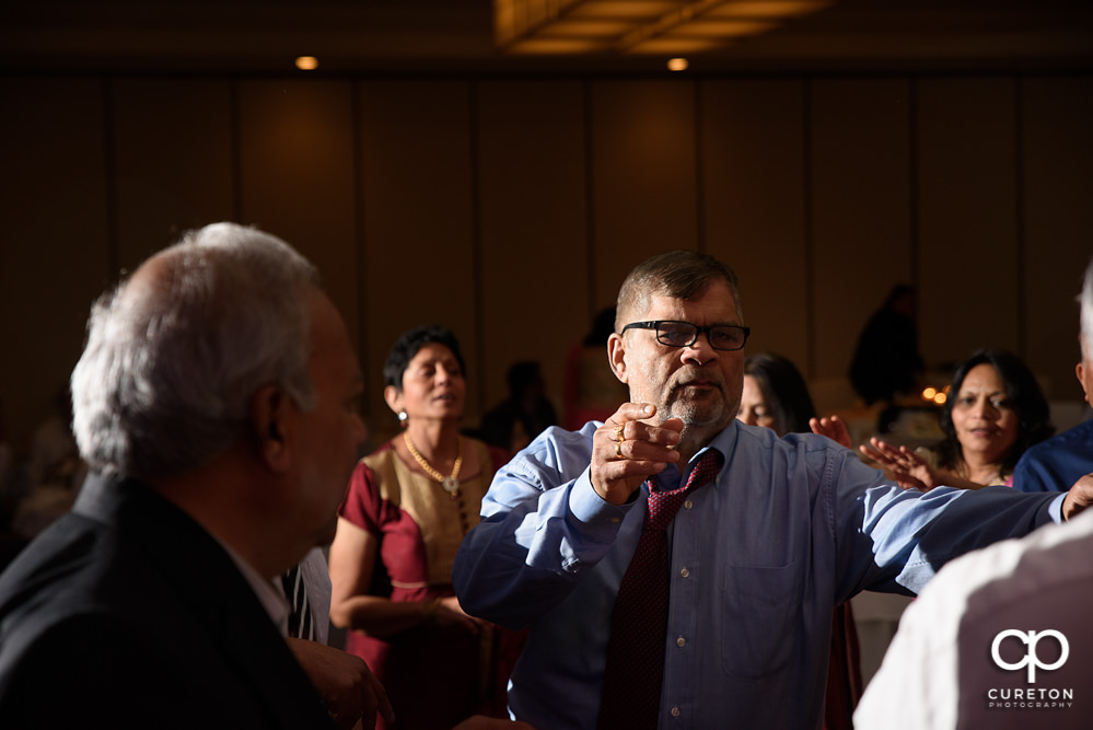 Wedding guests dancing at the reception.