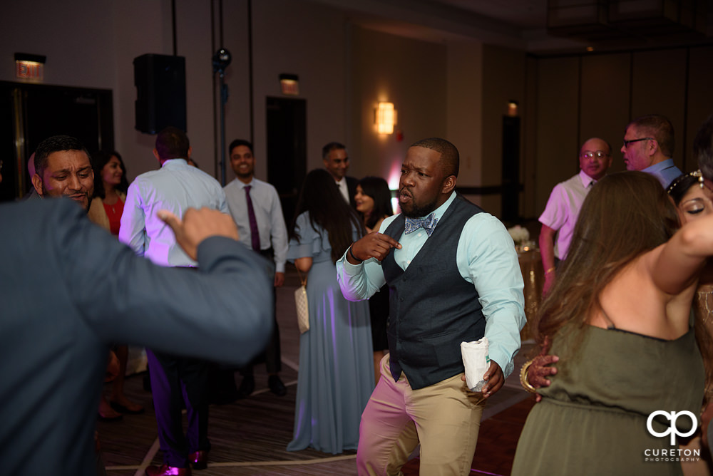 Wedding guests dancing at the reception.