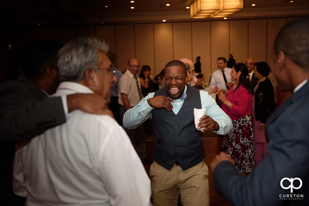 Wedding guests dancing at the reception.