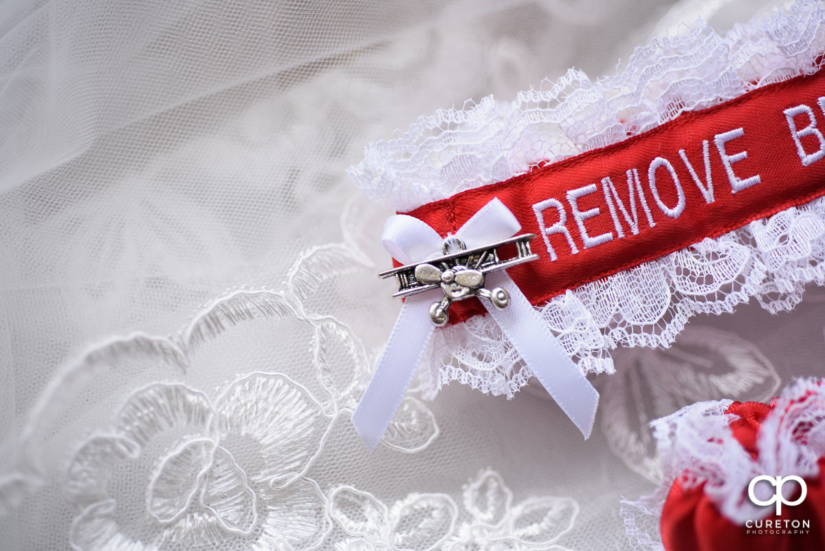 Airplane charm on the bride's garter.