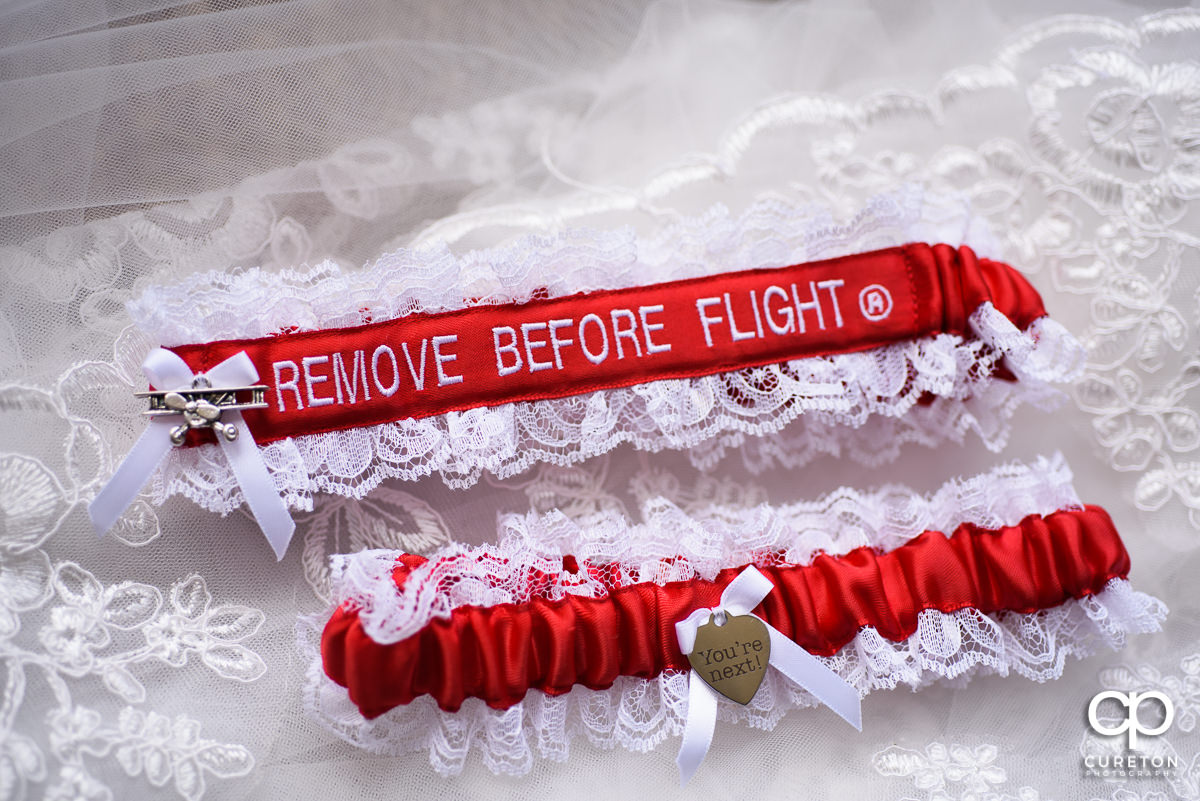 Garters that are adorned with "remove before flight".
