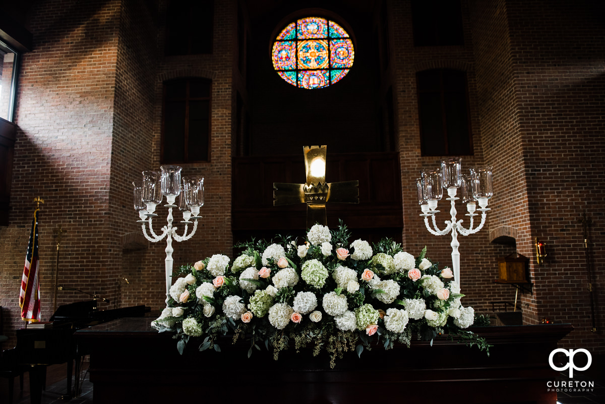 Wedding flowers on the alter.