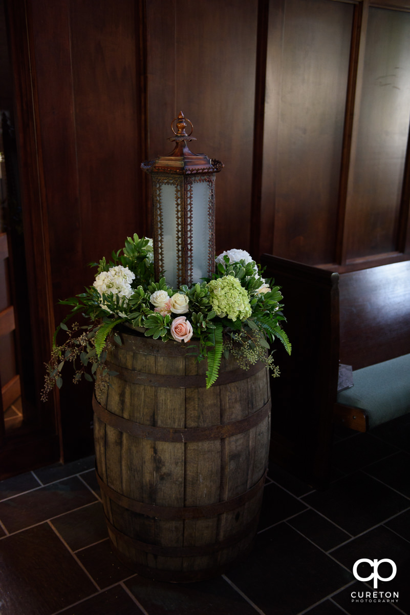 Floral arrangement on a barrel.