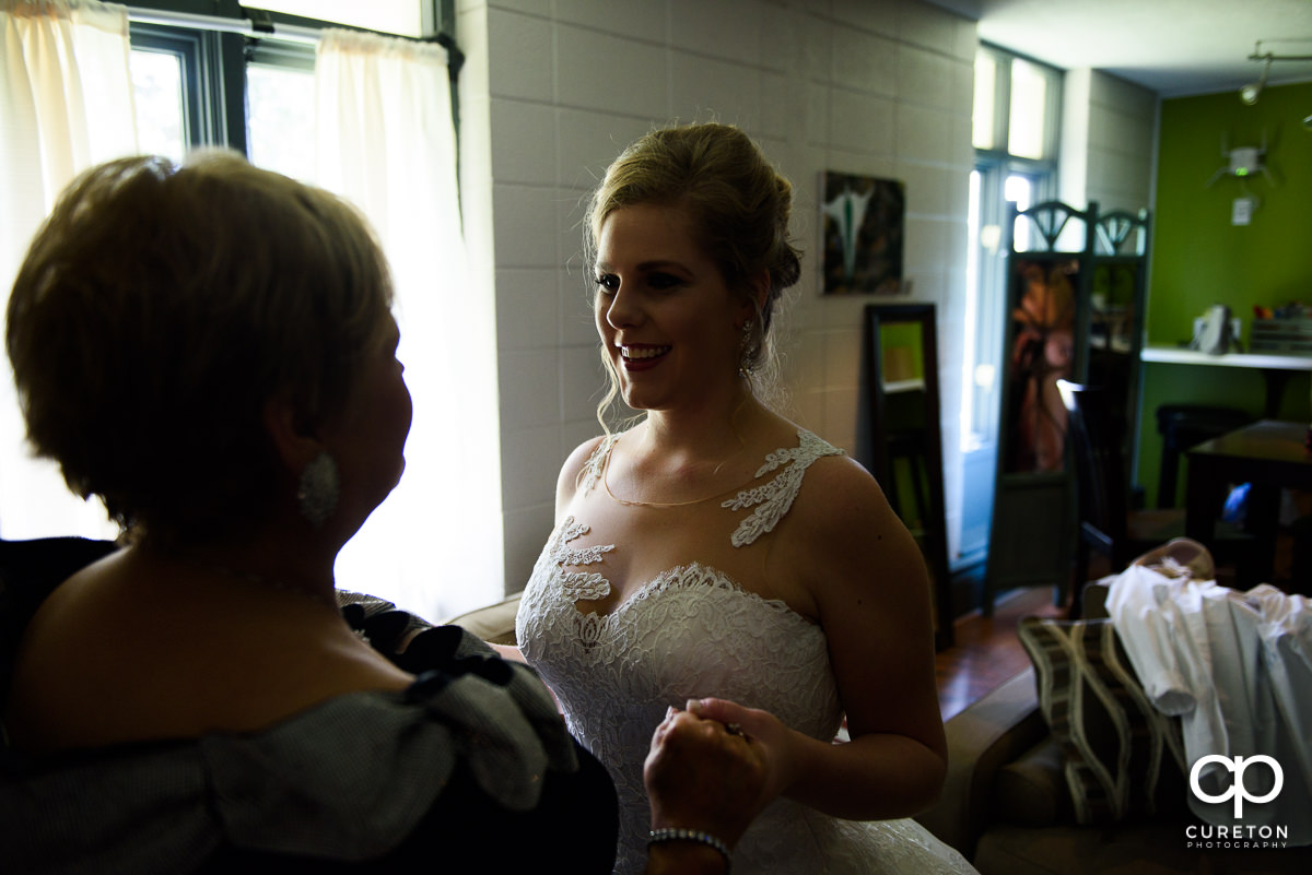 Bride looking at her mom before her wedding ceremony.