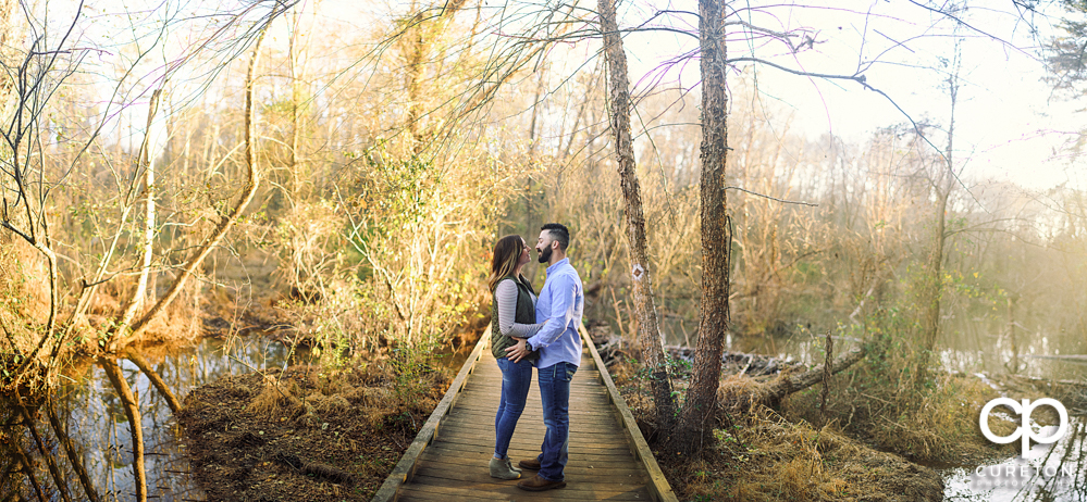 Panorama of a couple during their Lake Conestee Nature Park engagement session.