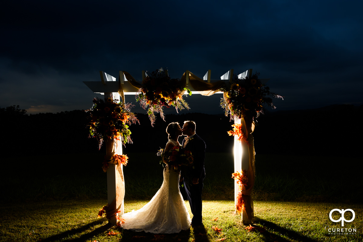 Backlit photo of a married couple at their Lindsey Plantation wedding.