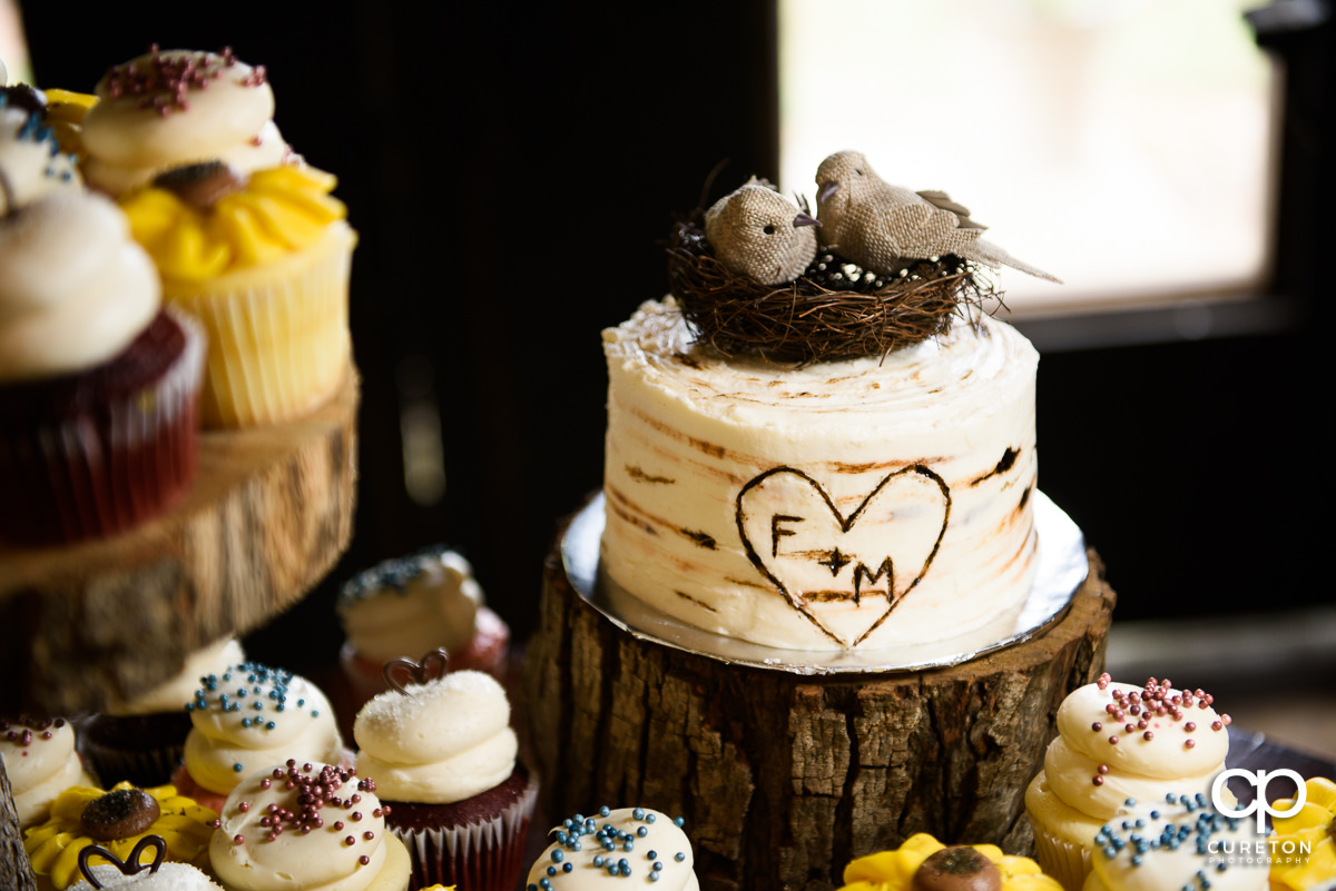 Bird's nest on top of a wedding cake.