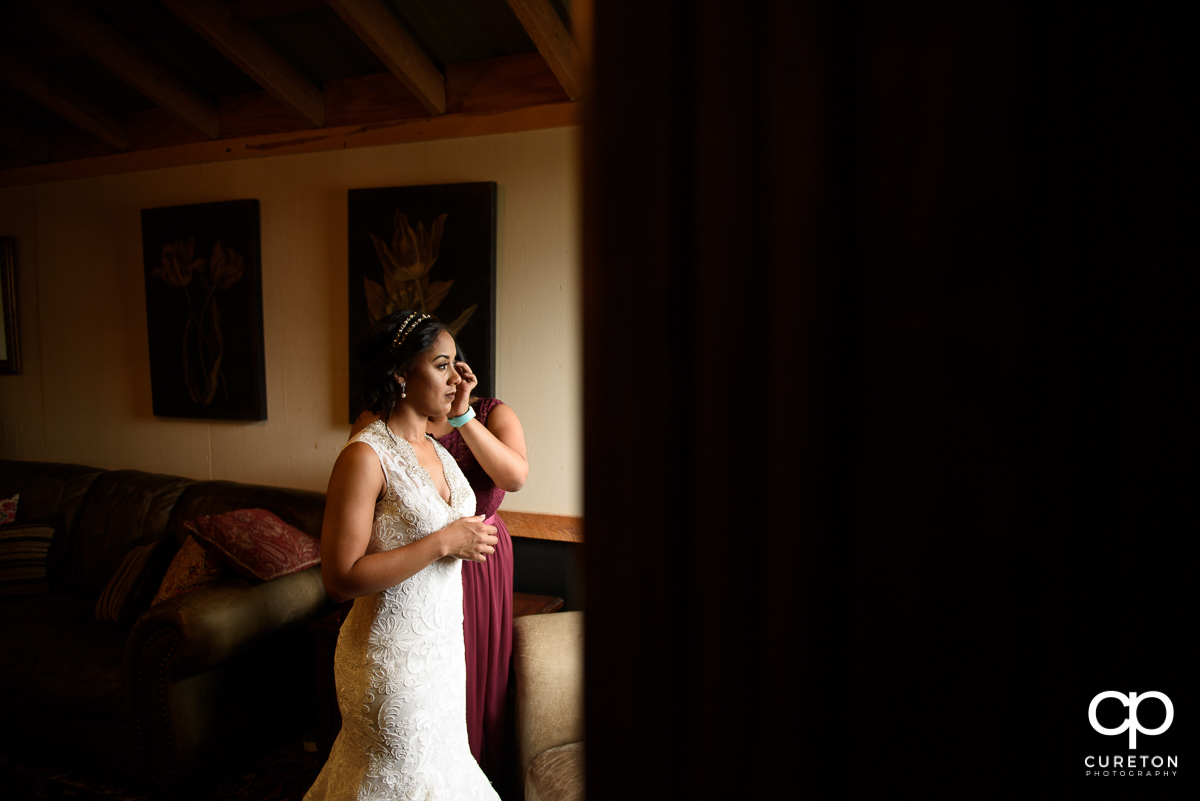 Bride putting in her earrings.