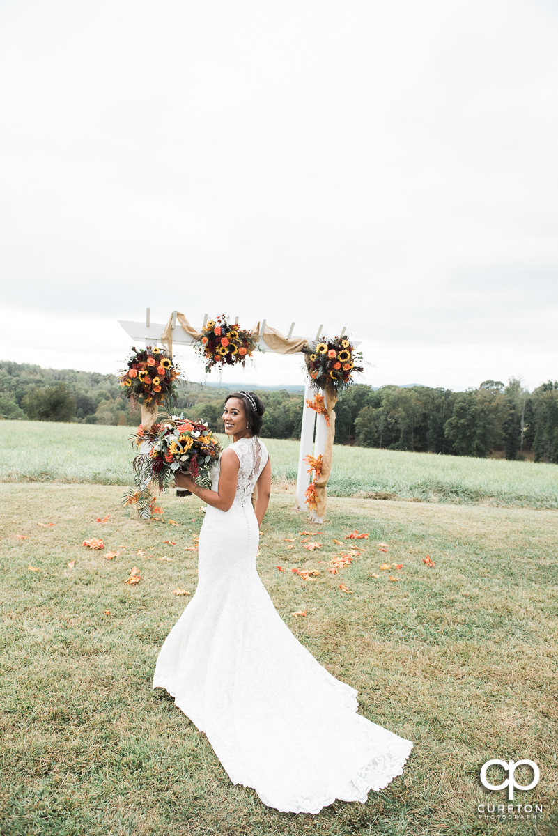 Bride with a gorgeous fall bouquet before her fall wedding at Lindsey Plantation in Taylors,SC.