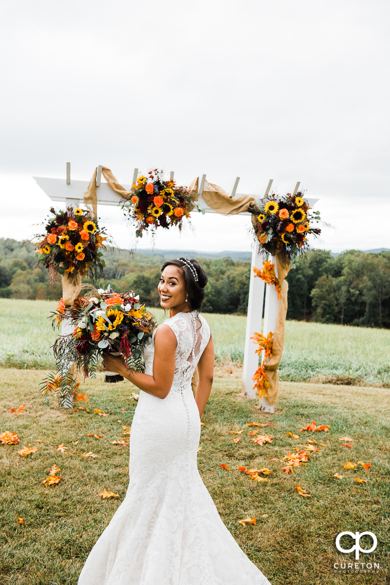 Bride an fall flowers before hwe wedding at Lindsey Plantation in Taylors,SC.