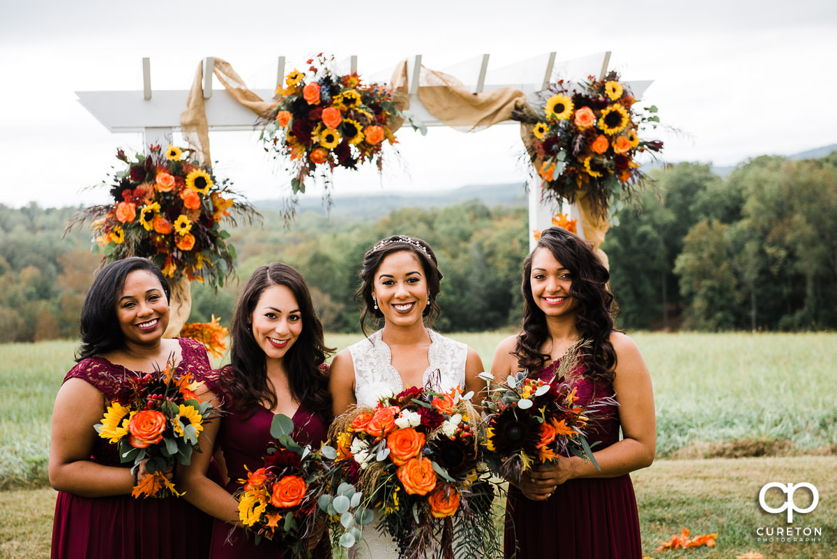 Bride and bridesmaids in the field.