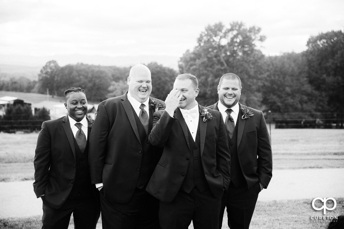 Groomsmen laughing.