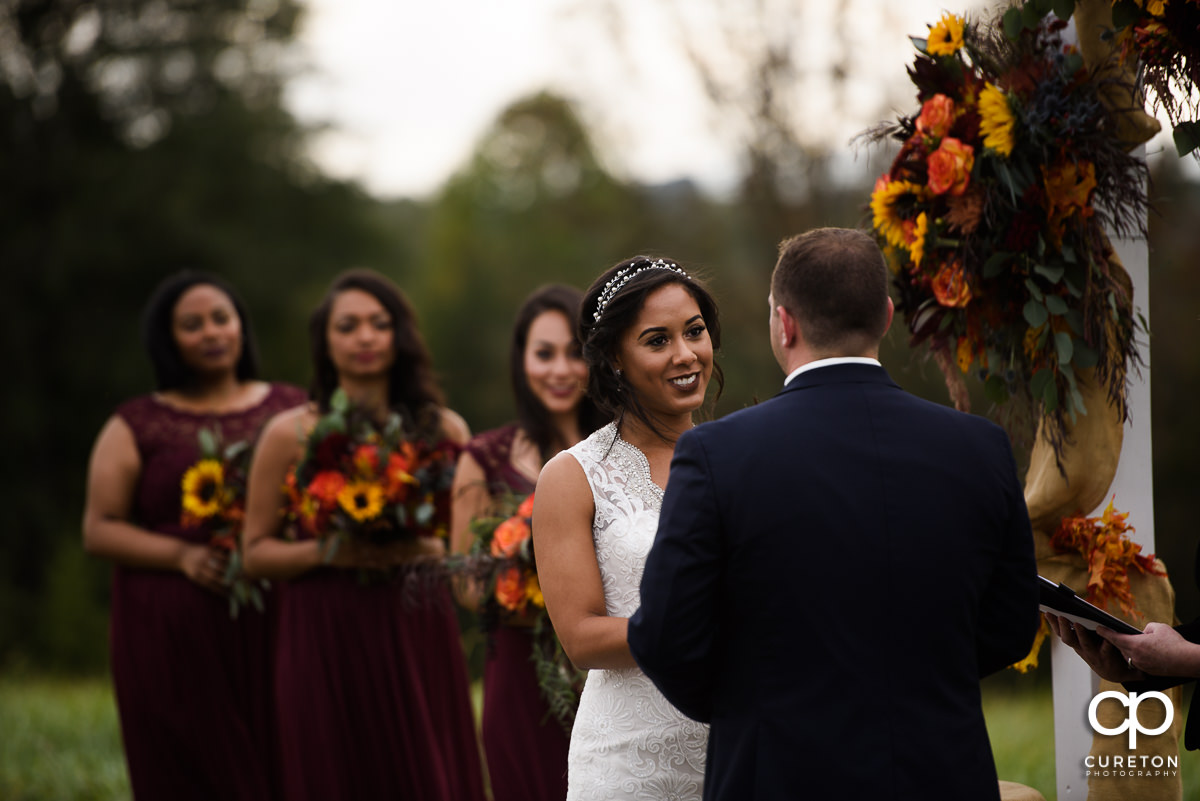 Bride looking at her groom during the wedding ceremony.