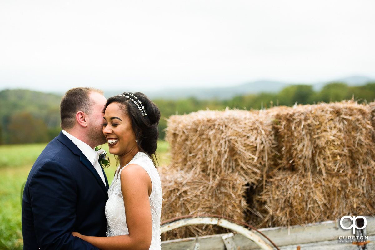 Bride laughing with her groom.