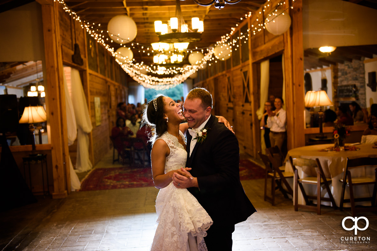 Husband and wife dancing at their reception.