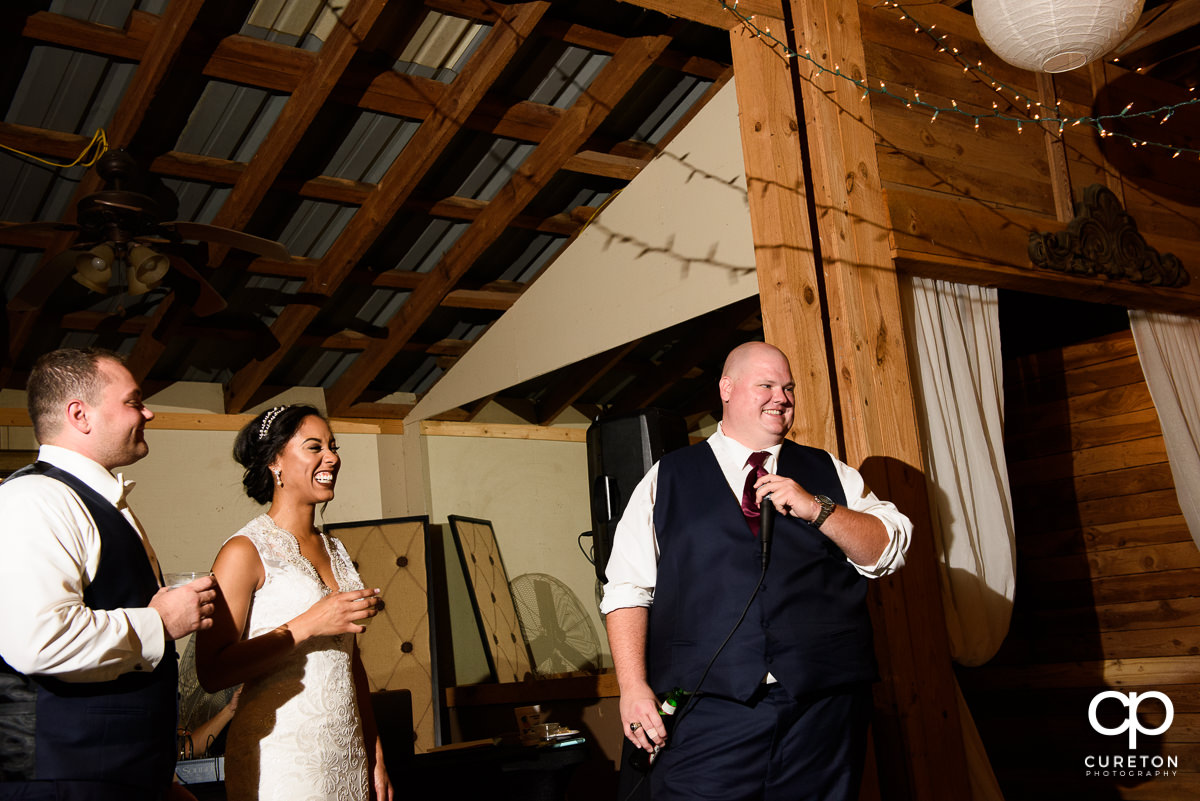 Best man toasting the couple.