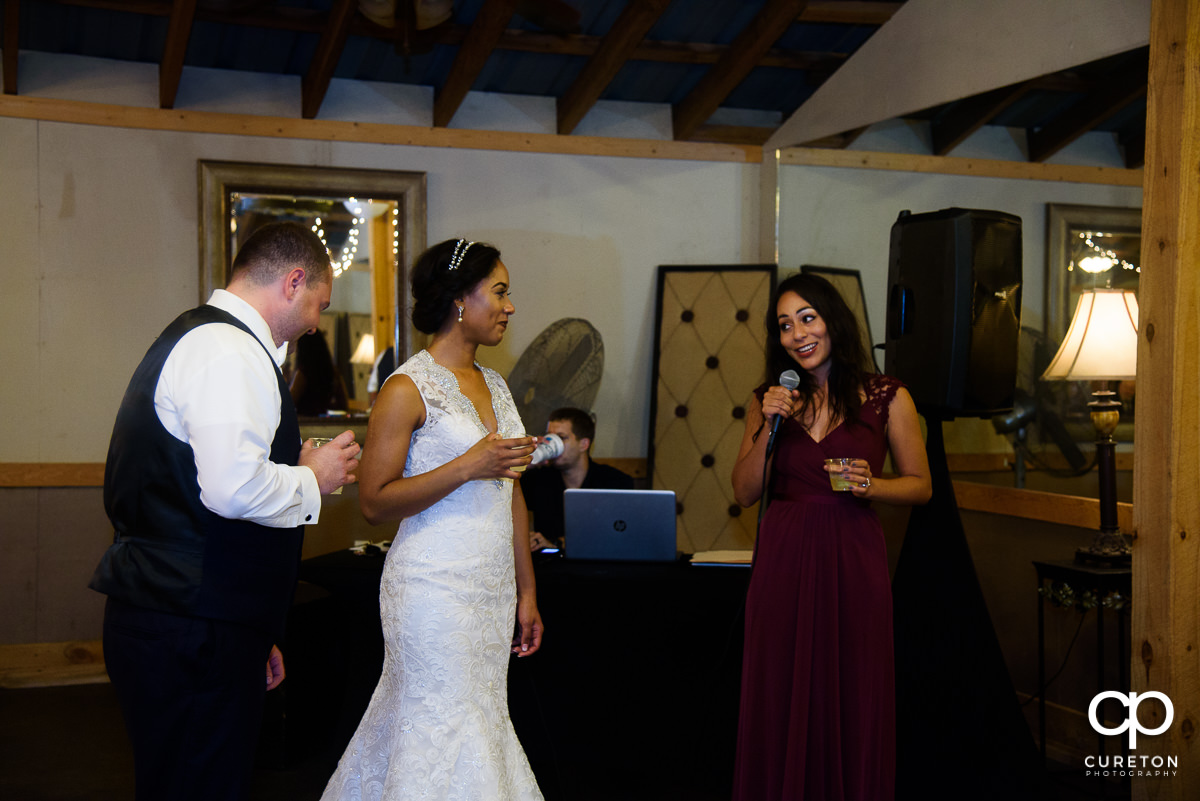 Bridesmaid giving a toast.