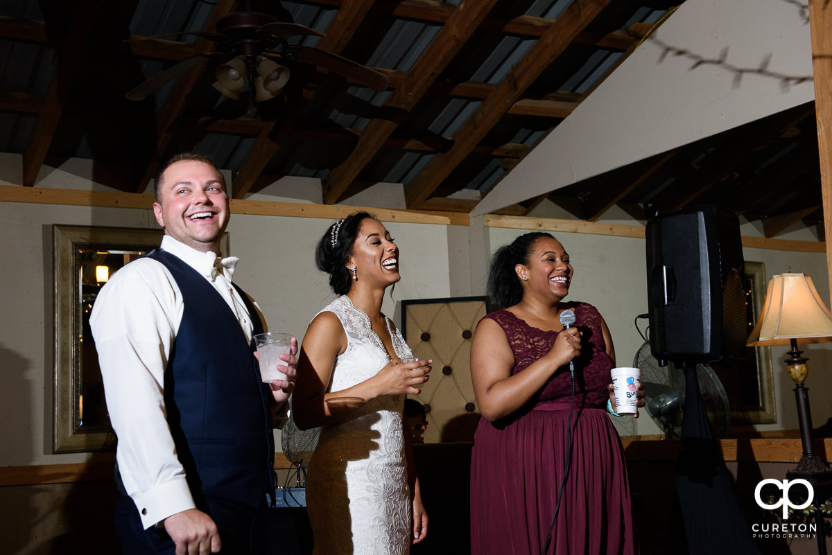 Bridesmaid giving a toast at the reception.