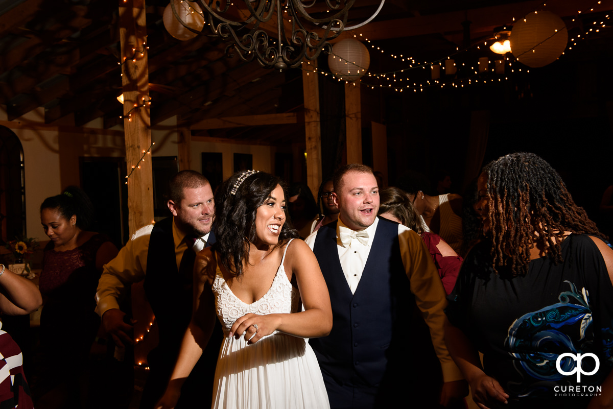 Bride and groom dancing.