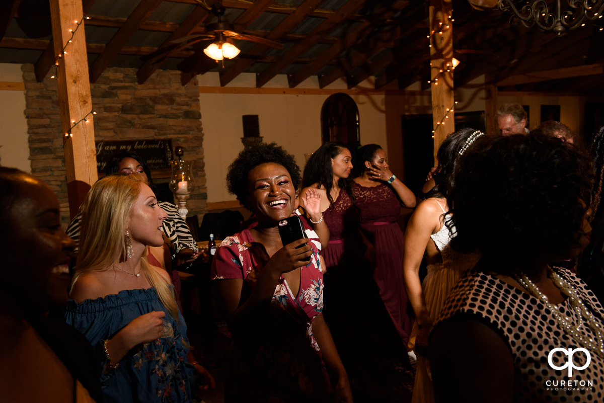 Wedding guests on the dance floor at the reception.