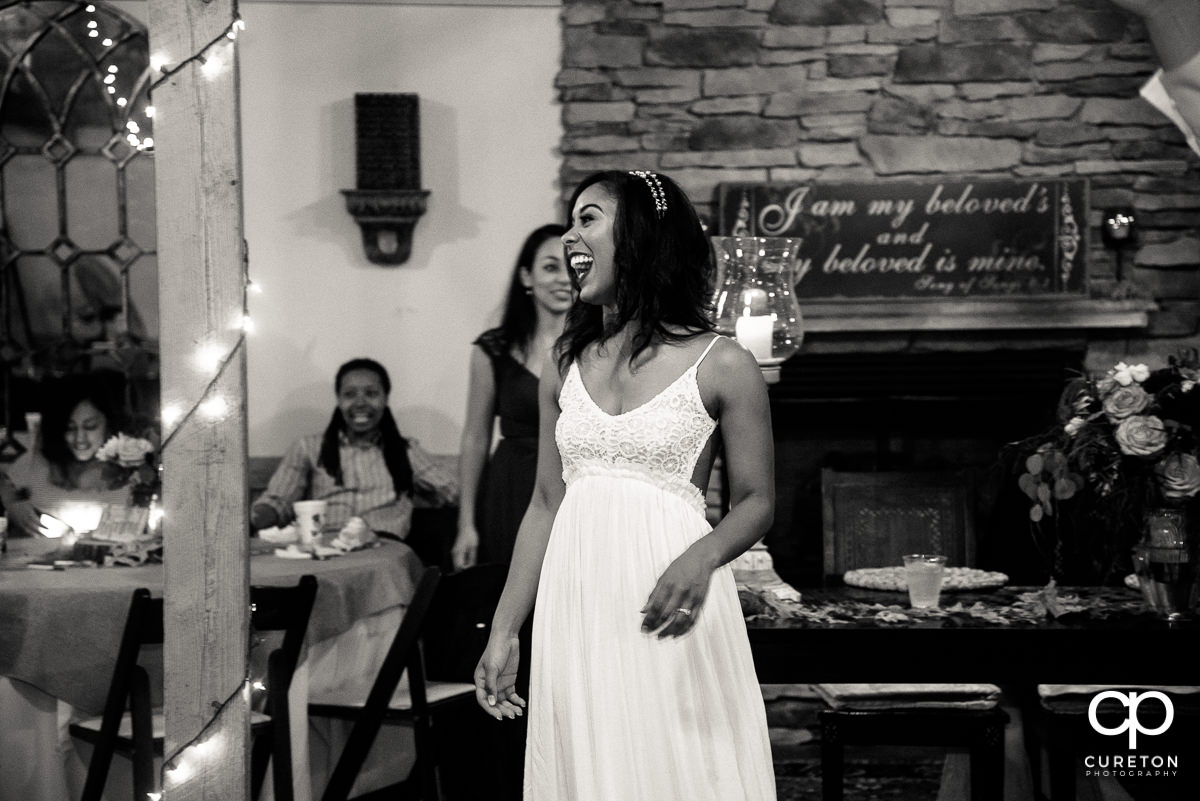 Bride laughing.