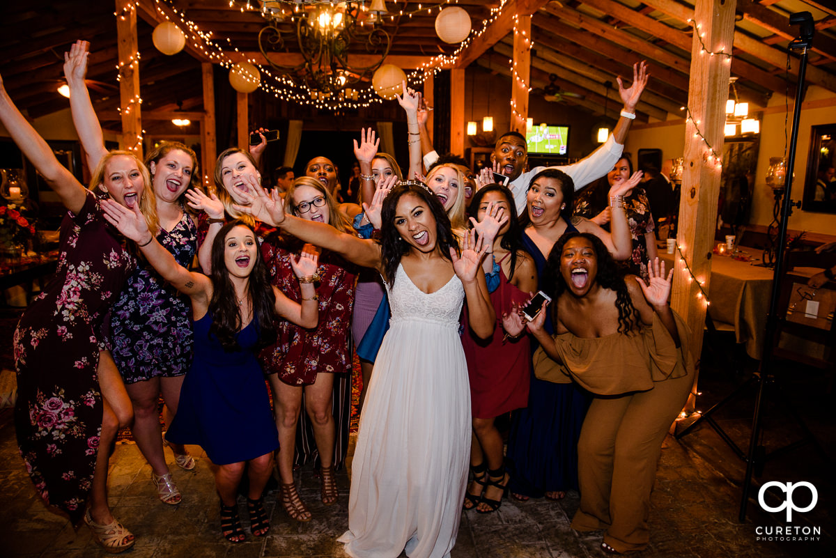 Bride and her friends cheering.
