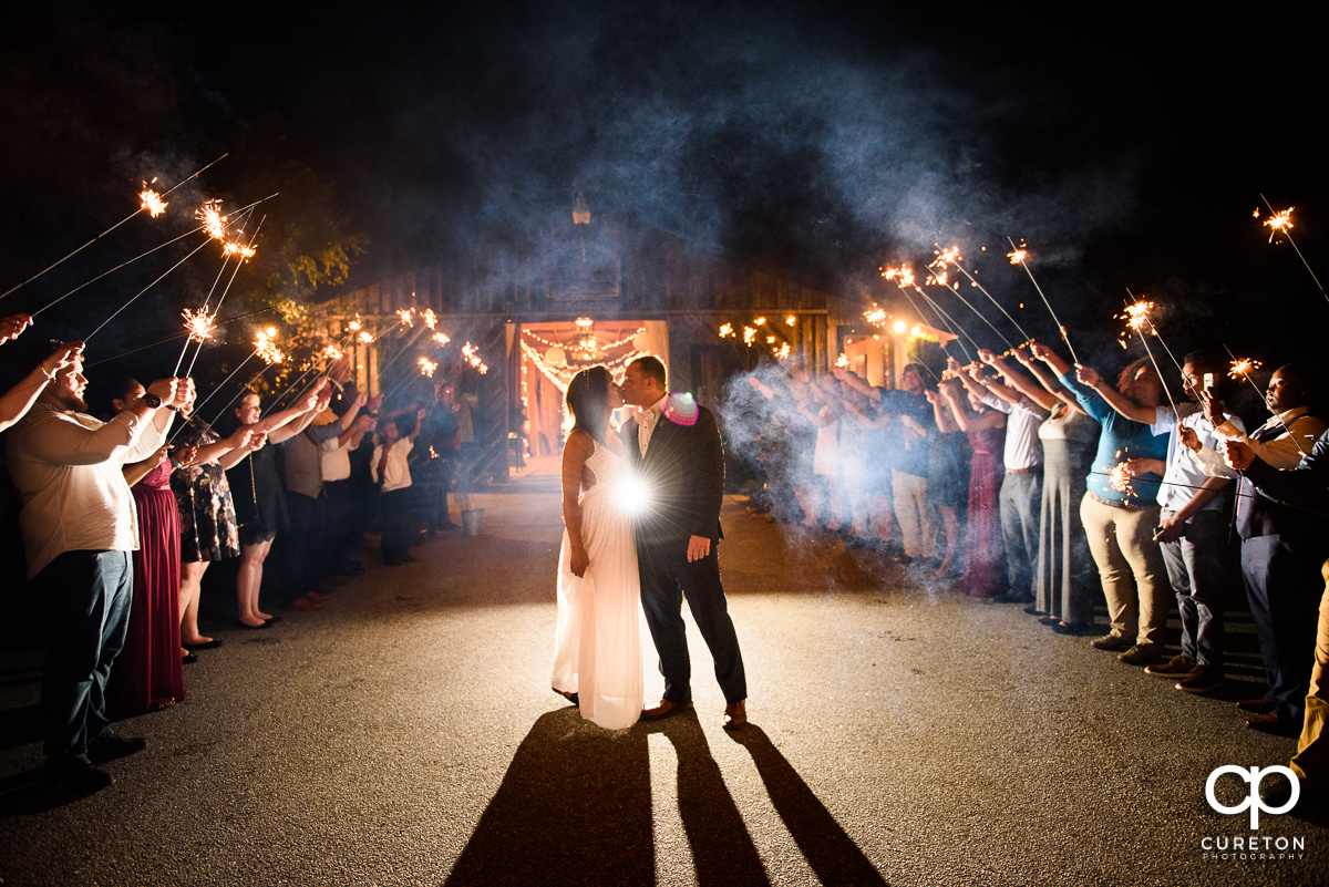 Bride and groom make a grand exit at their Lindsey Plantation wedding reception.