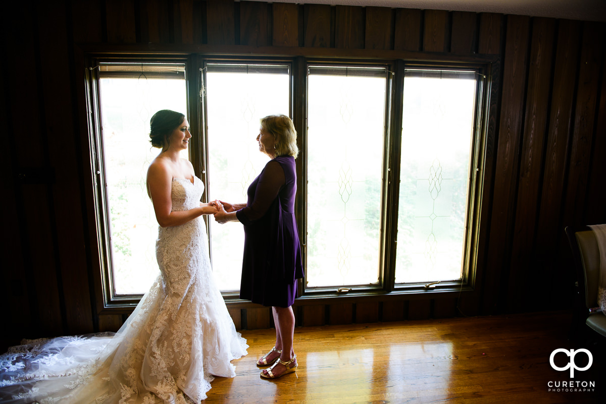 Bride and her mother sharing a moment.