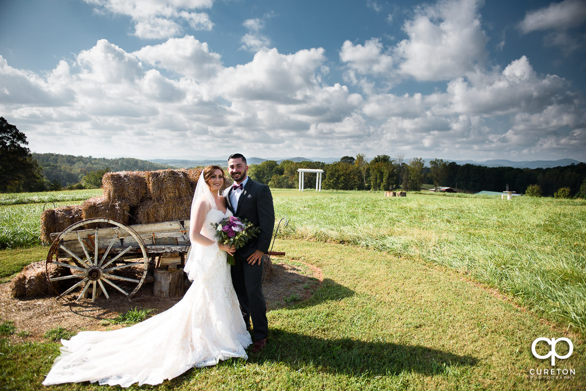 Bride and groom in the field at Lindsey Plantation.
