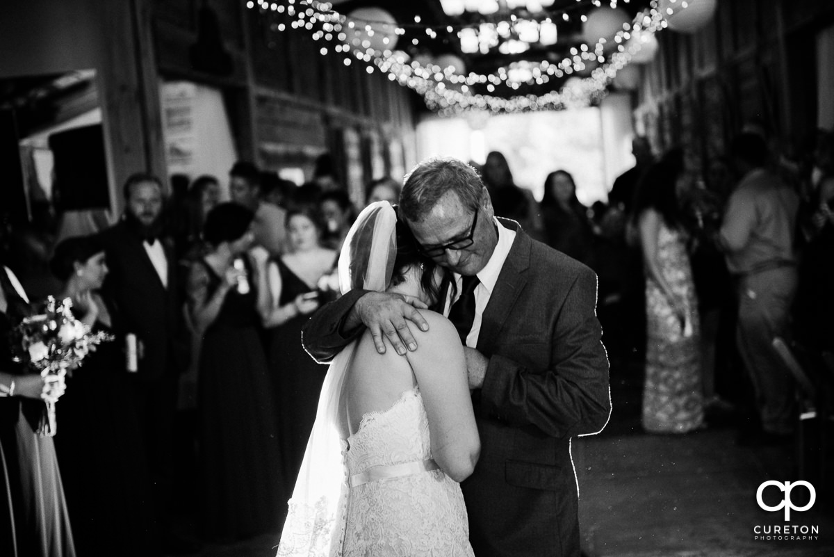 Bride and her dad share a dance.