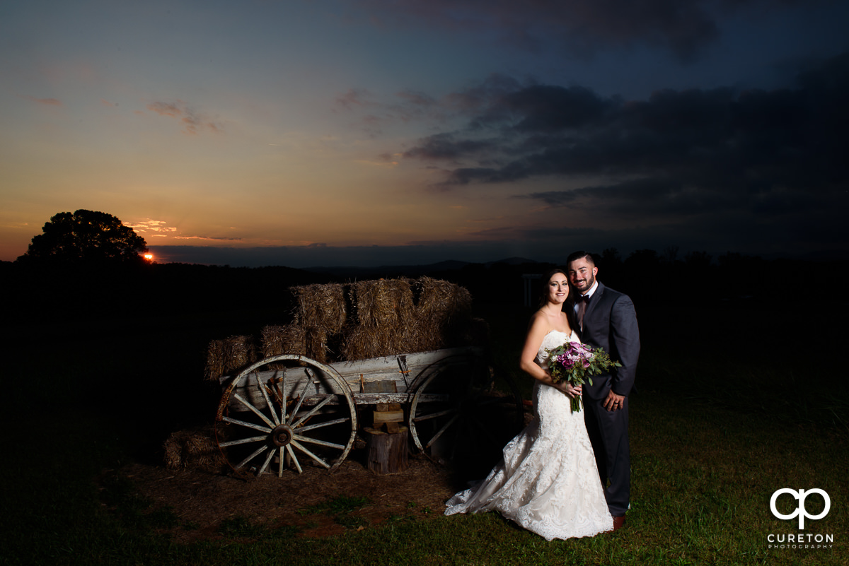 Bride and groom at sunset in the pasture at Lindsey Plantation in Taylors,SC