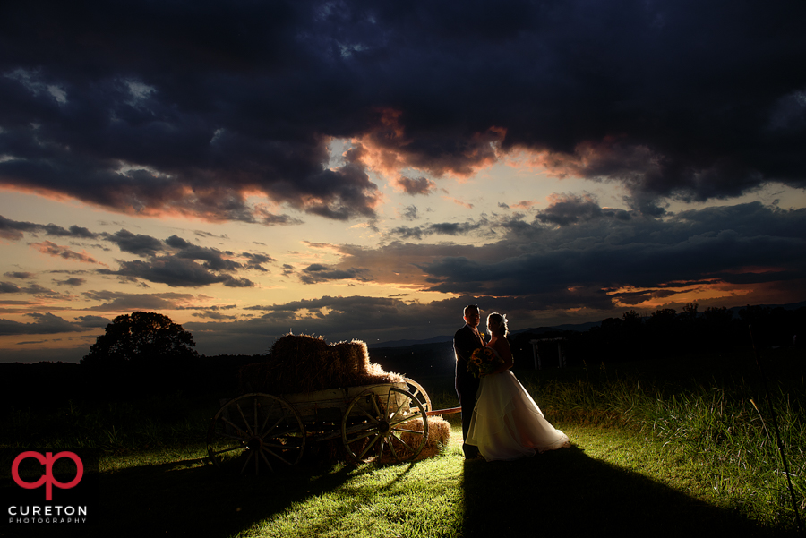 Epic bride and groom during sunset at their rustic wedding venue near Greenville,SC.