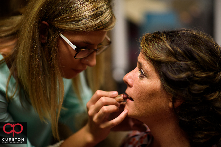 Bride getting makeup.