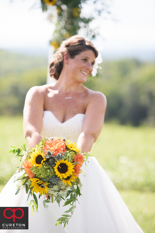 Bride holding flowers from Dahlia.