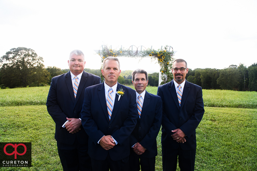 Groomsmen in the field.