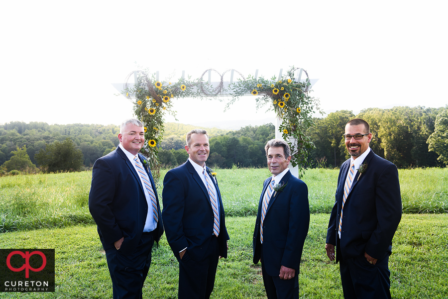 Groomsmen in the field.