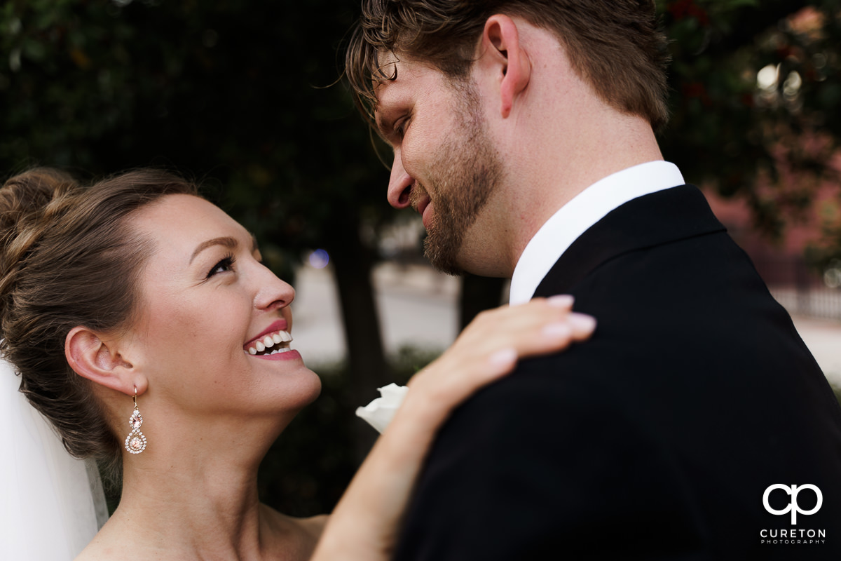 Bride smiling at her husband.