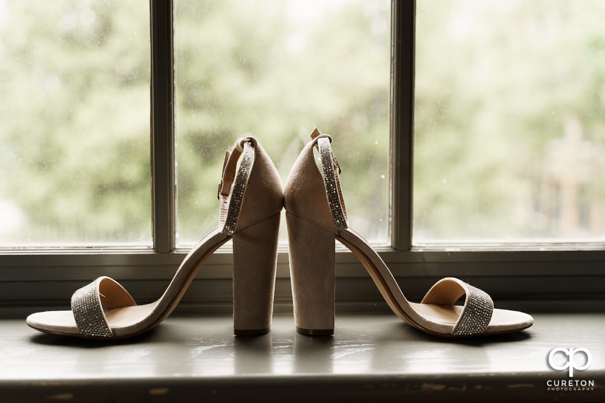 Bride's high heel shoes in the window at Soby's.