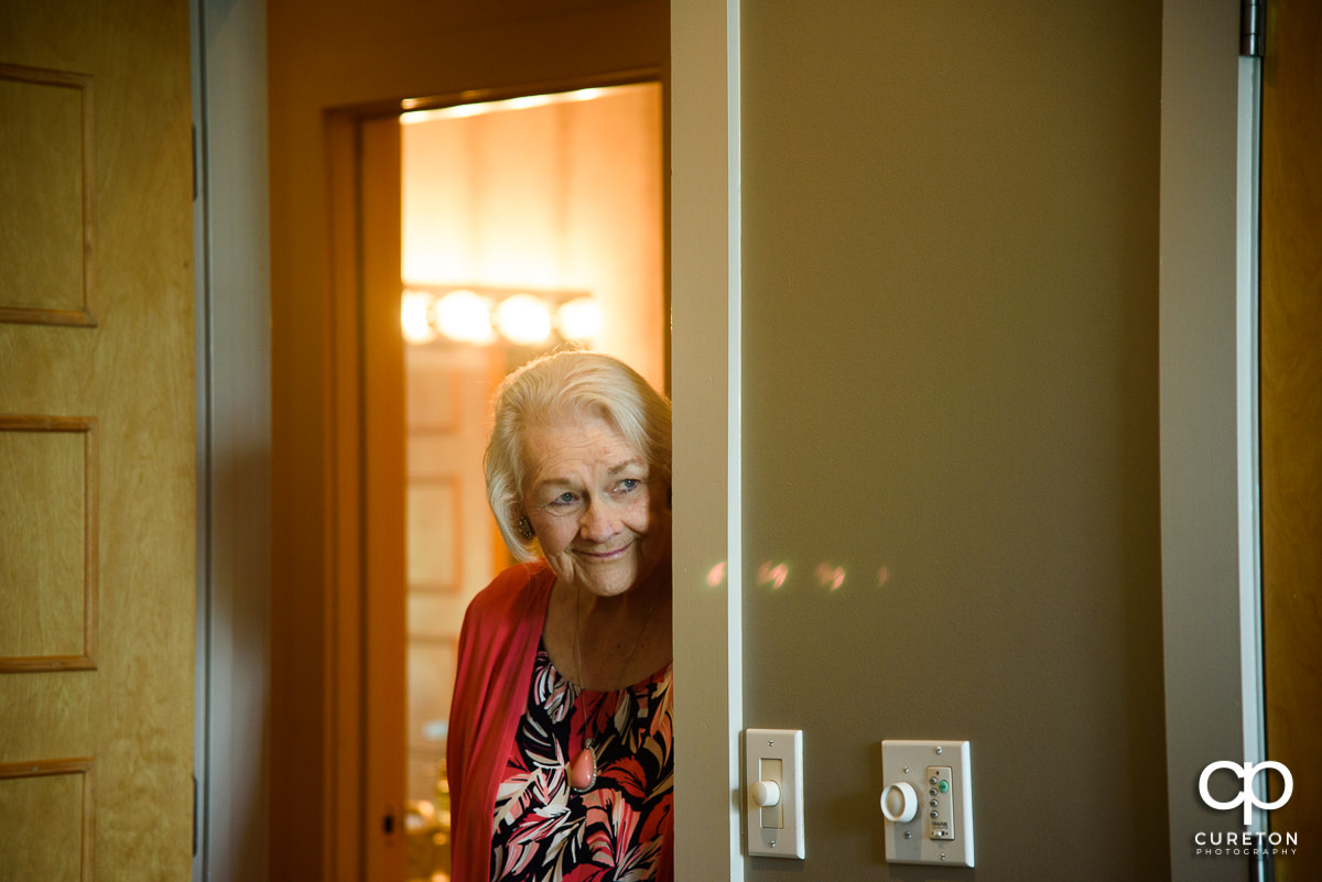 Bride's grandmother watching her get ready for her wedding.