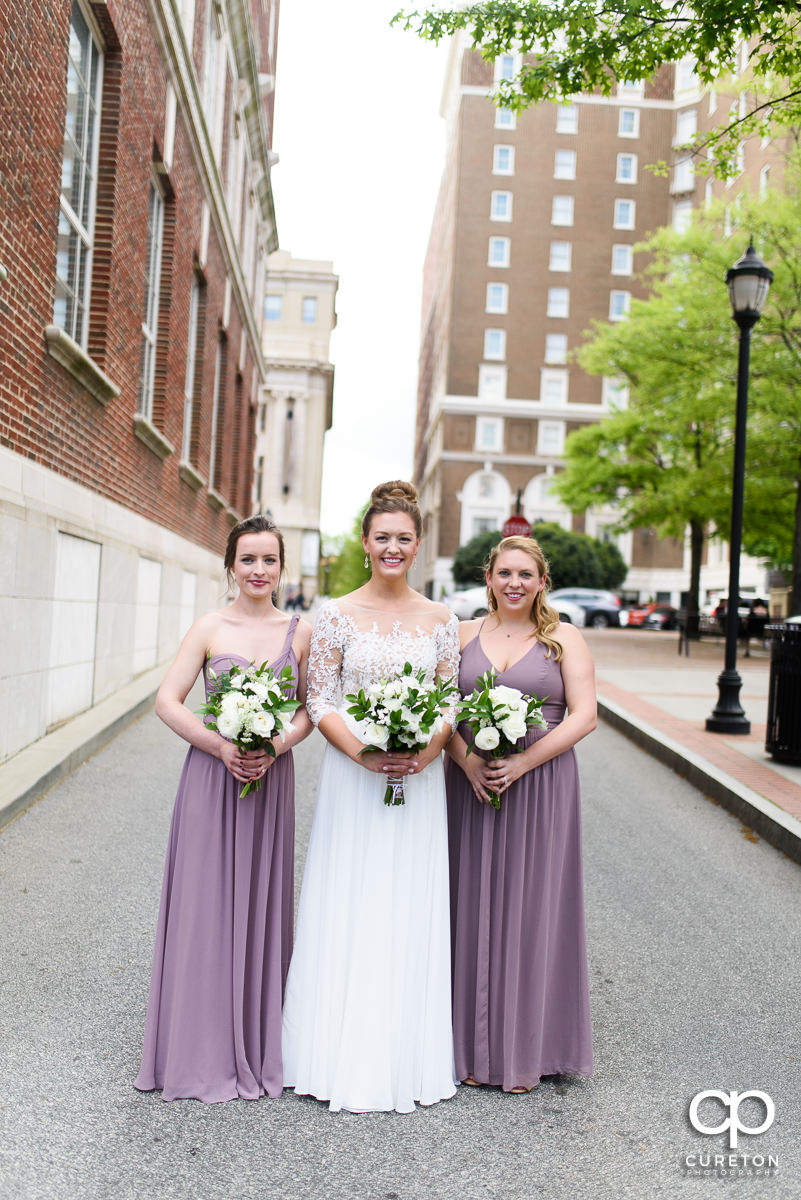 Bride and her bridesmaids hanging out in downtown Greenville before the wedding ceremony.