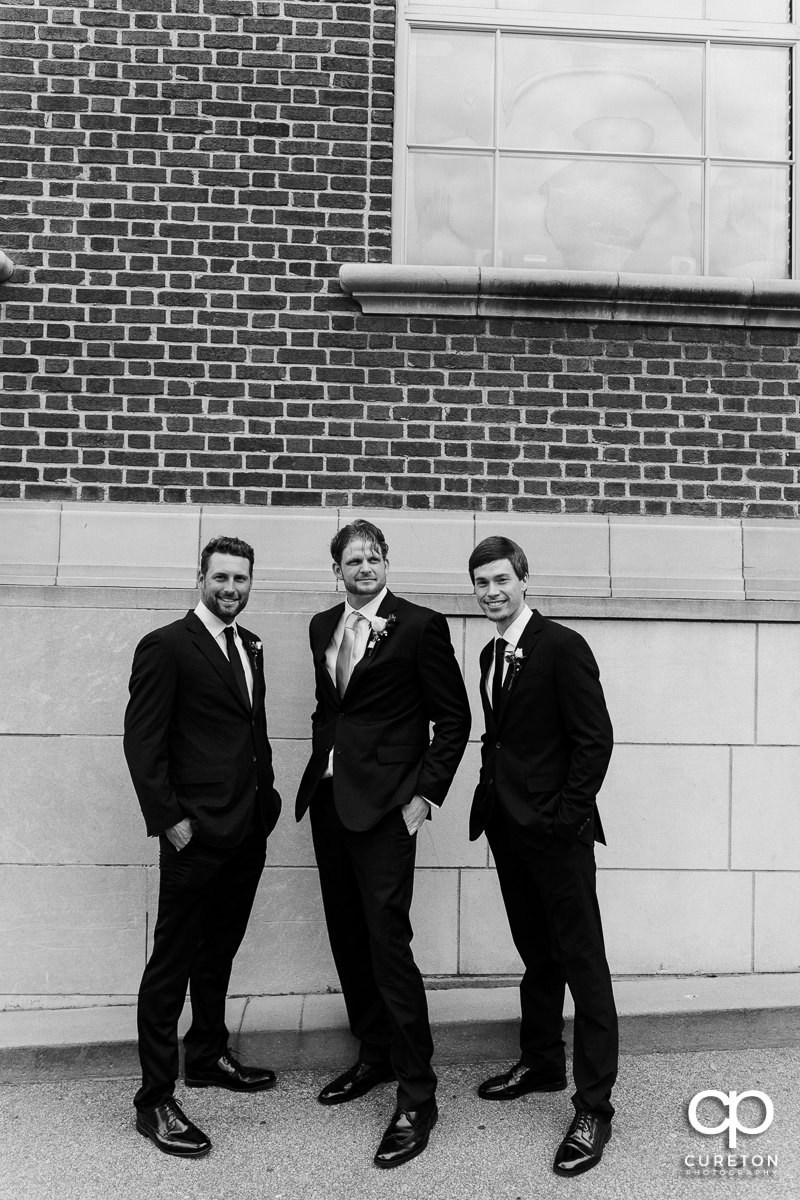 Groom and groomsmen hanging out on Main Street before the wedding.