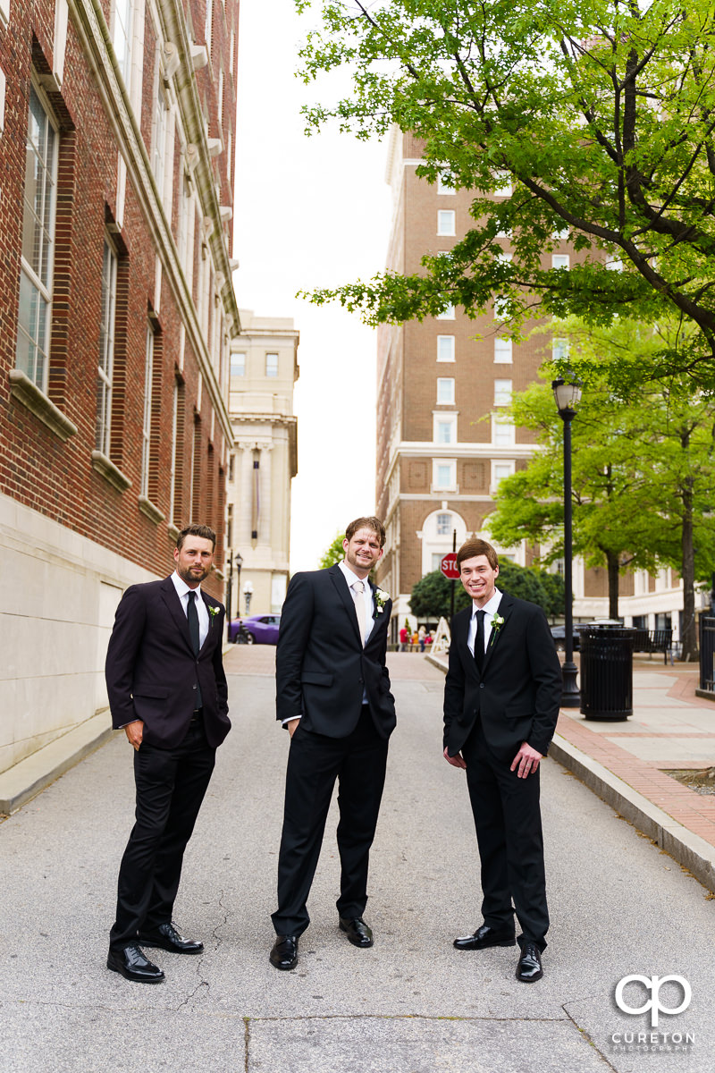 Groom and groomsmen standing on Main Street.